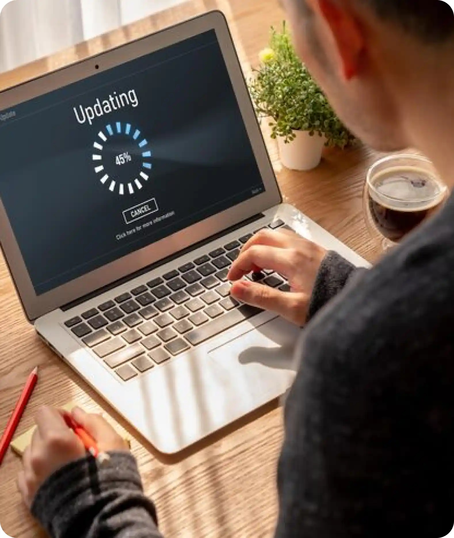 Young couple smiling at laptop